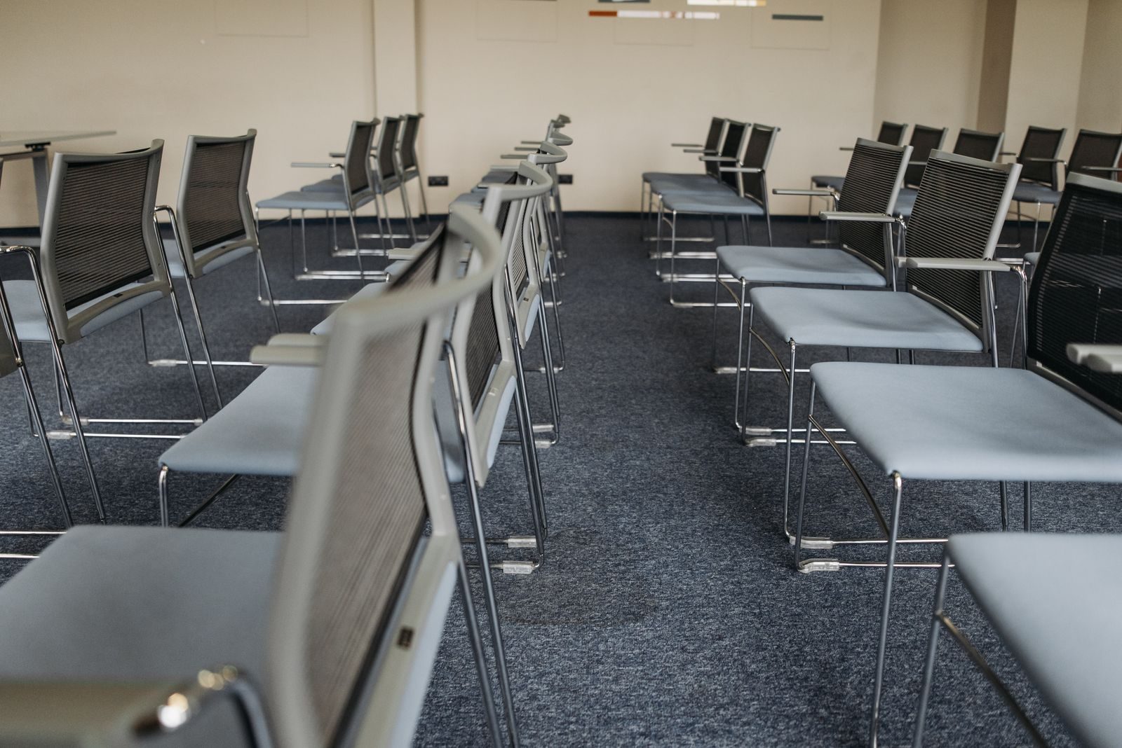 Rows of chairs in an empty conference room
