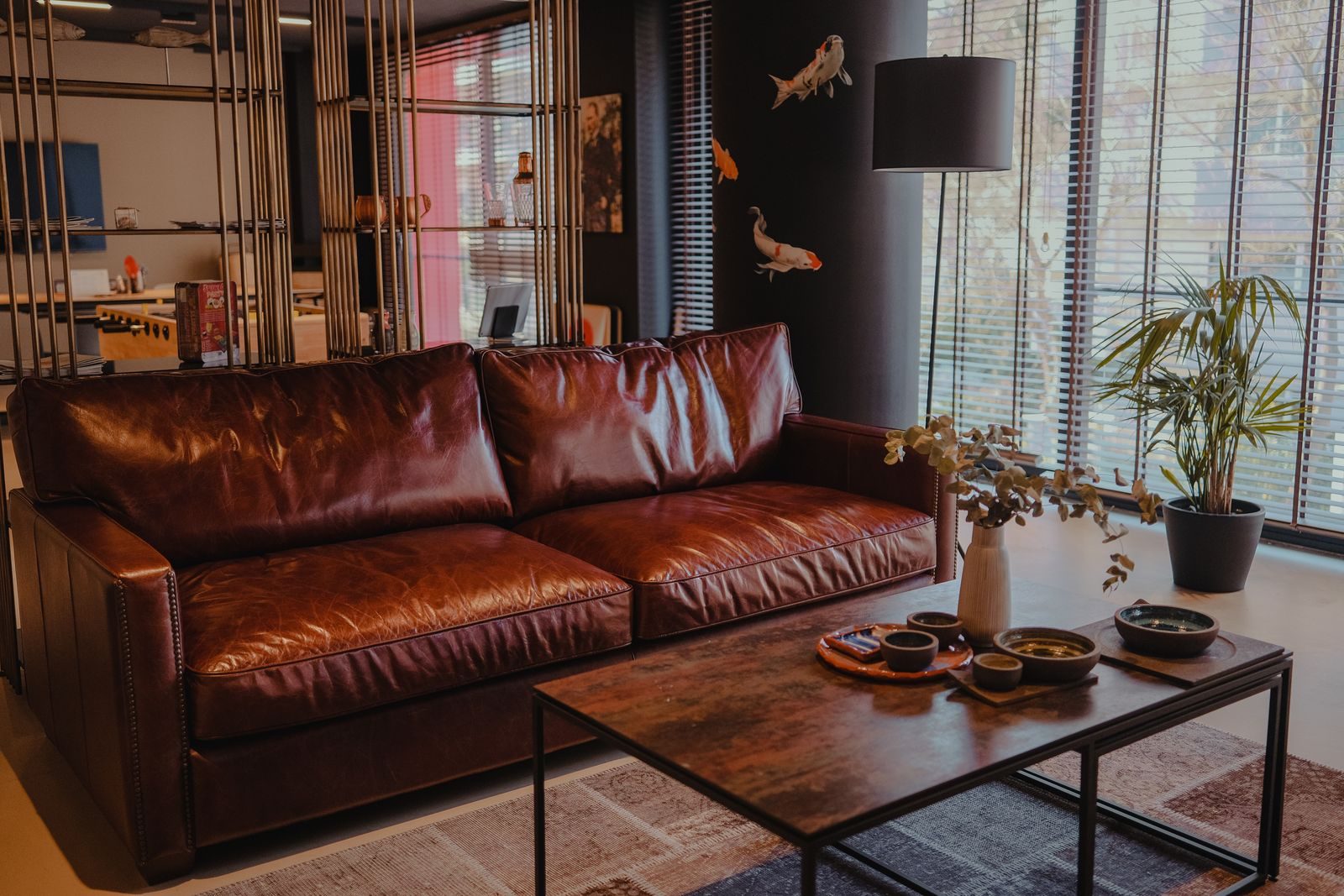 A brown leather sofa in a stylish living room